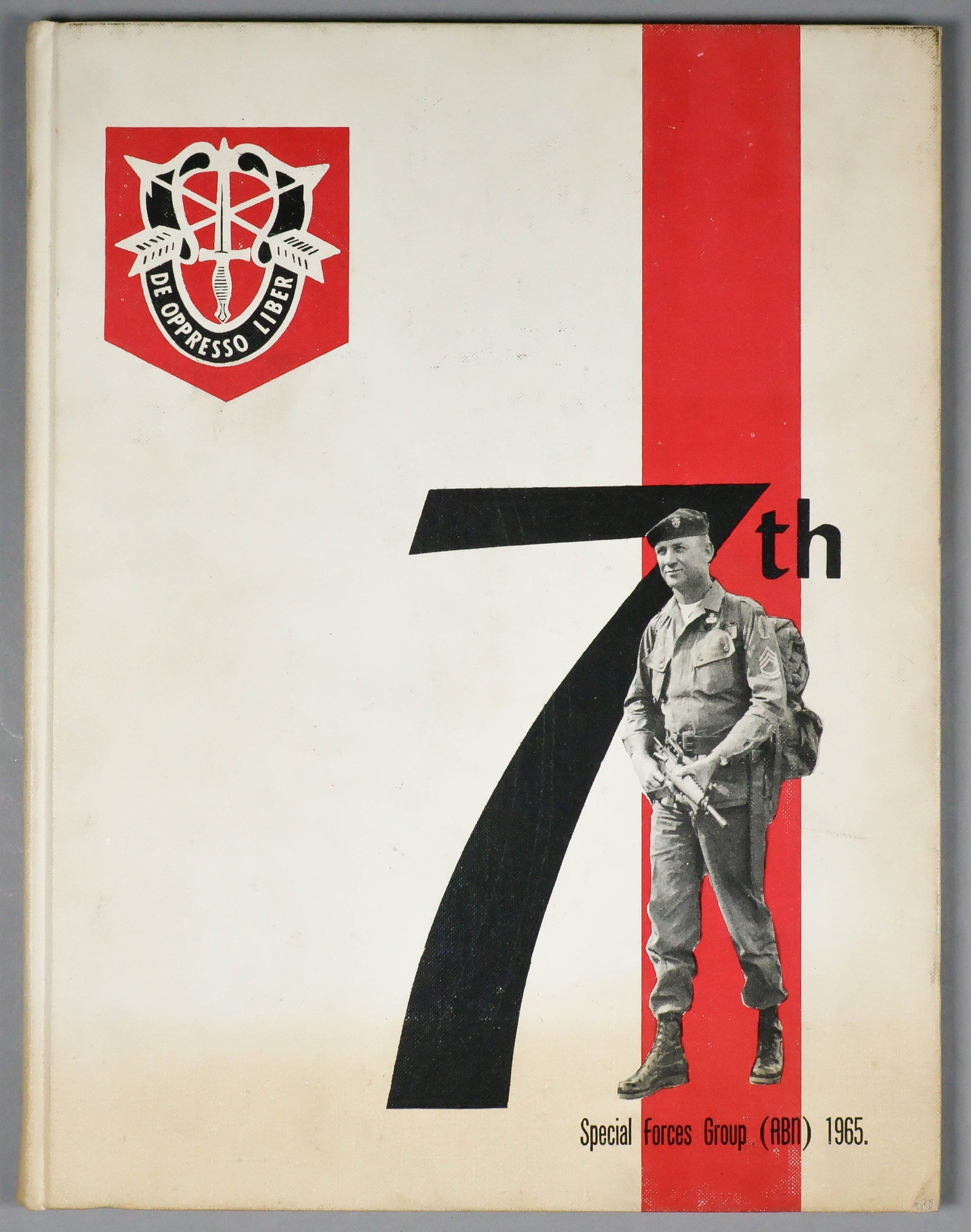 7TH SPECIAL FORCES (AIRBORNE) 1965 CLASS BOOK: Class book for a class of several hundred Green Beret soldiers, all having completed training as members of the 7th Special Forces (ABN) 1965. The book, approx. 80pp. 4to., is bound in white cloth
