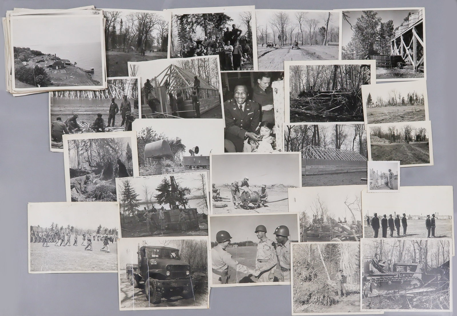 BLACK SOLDIERS BUILD ARTILLERY BASE: Lot of appox. 50 8 x 10 in. b/w Army photographs of largely black soldiers during construction in the area around the Big Bay Point Lighthouse in Michigan for use as anti-aircraft artillery training,