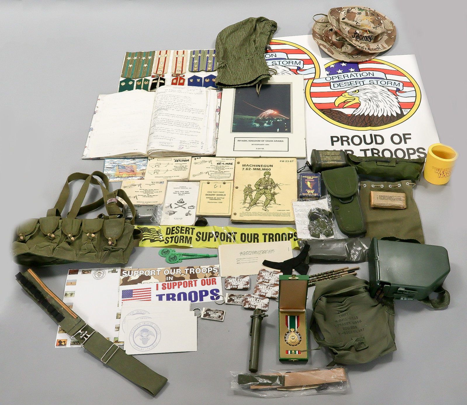 GULF WAR BRING-BACKS, EQUIPMENT AND SOUVENIRS: A large box lot featuring a wide variety of U.S. military equipment and souvenirs related to Operations Desert Storm and Desert Shield, as well as items captured from Iraqi forces during the First