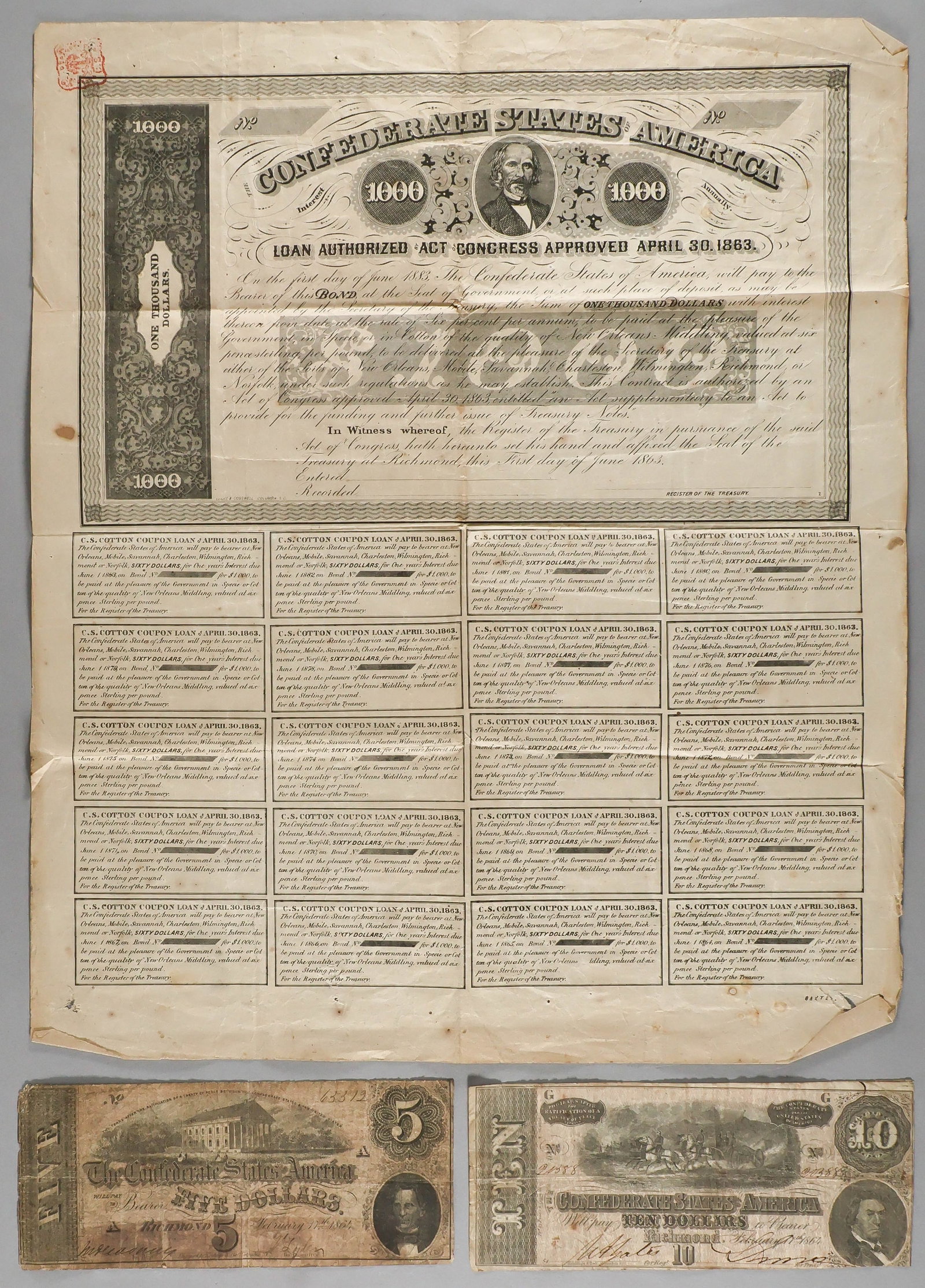 CONFEDERATE BOND AND CURRENCY (3): Lot of three pieces includes a C.S.A. $1,000 bond, June 1, 1863, unsigned and unissues, all coupons attached; a $10 C.S.A. note, Richmond, Feb. 17, 1864, and a $5.00 C.S.A. note, Feb. 17, 1864. Notes