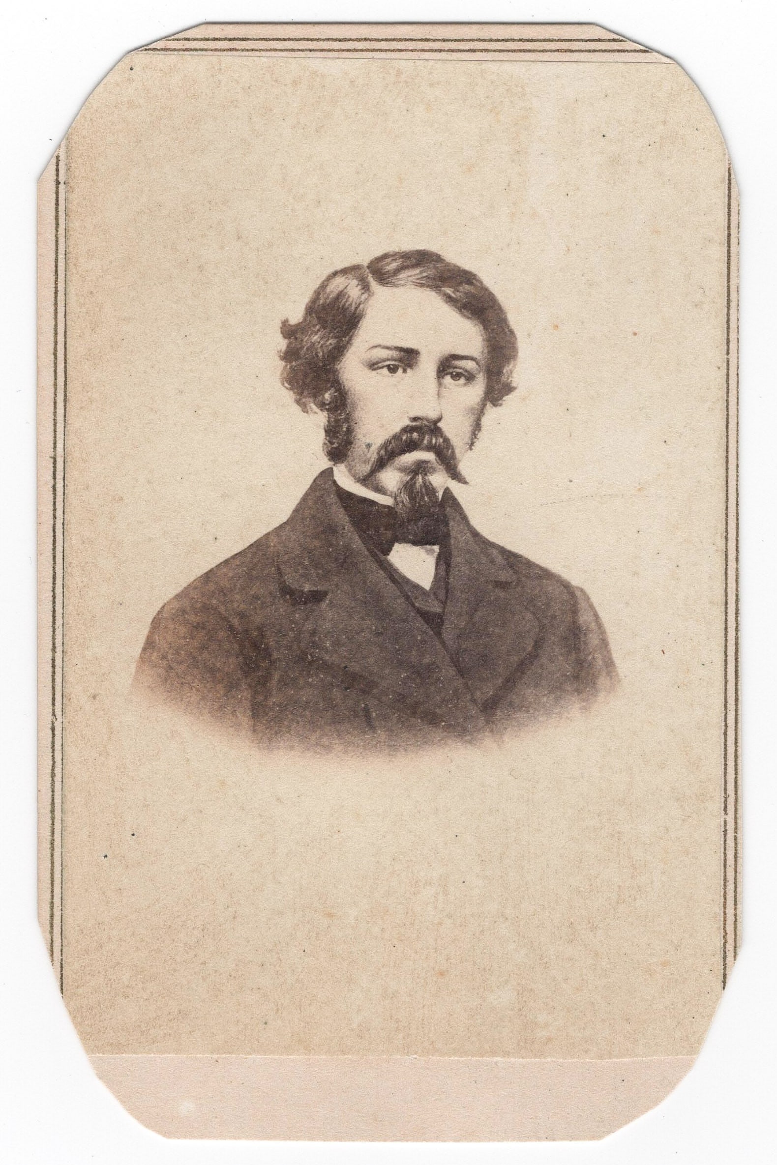 WILLIAM C. QUANTRILL CARTE DE VISITE: A scarce carte de visite, 2.25 x 3.75 in. sepia, featuring a chest-up illustration of Confederate guerrilla leader WILLIAM C. QUANTRILL (1837-1865) in civilian clothing. The verso bears the backstamp