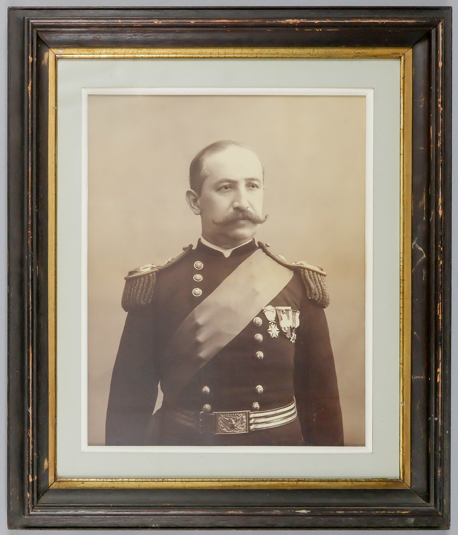 OVERSIZE PORTRAIT OF A CIVIL WAR OFFICER: A stunning oversize post-war sepia photographic portrait, 16 x 20 in. [sight], showing a highly decorated one-star Union cavalry general in a waist-up pose. Emblazoned on his chest are medals