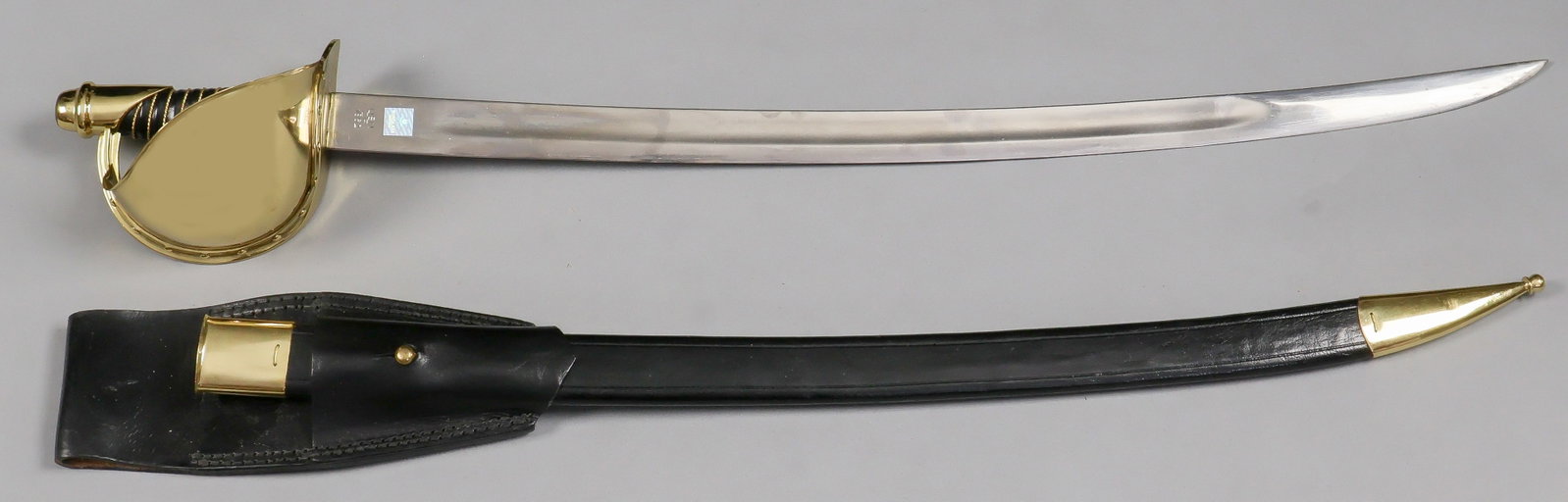 U.S. NAVY MODEL 1861 CUTLASS (REPRODUCTION): A modern reproduction U.S. Navy M1861 cutlass, 26 in. blade, 31.74 in. overall, produced in India by Windlass Steelcrafts and so marked on either side of the ricasso, along with facsimile U.S. Navy