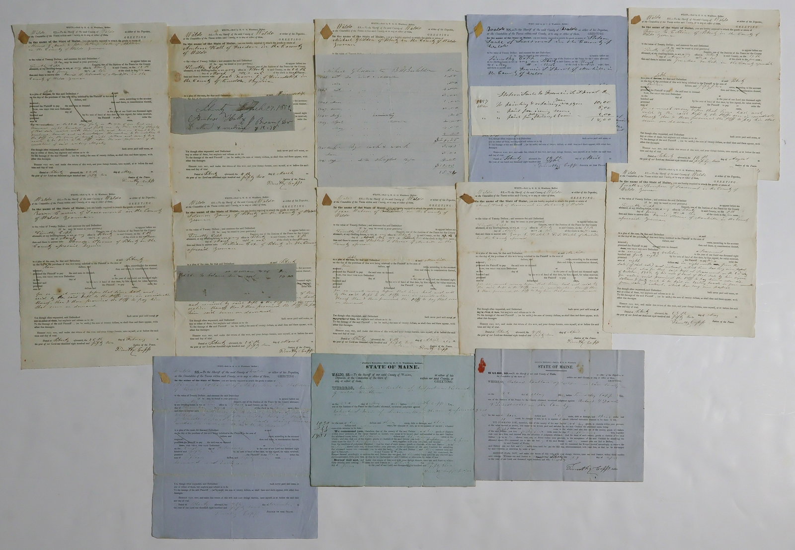 1850s LEGAL DOCUMENTS FROM MAINE (14): A group of 14 partly-printed D.Ss., each 2pp. 8vo., 1852-1857, in which Timothy Copp, Justice of the Peace in the county of Waldo, ME, orders the appearances of individuals before him to settle debts