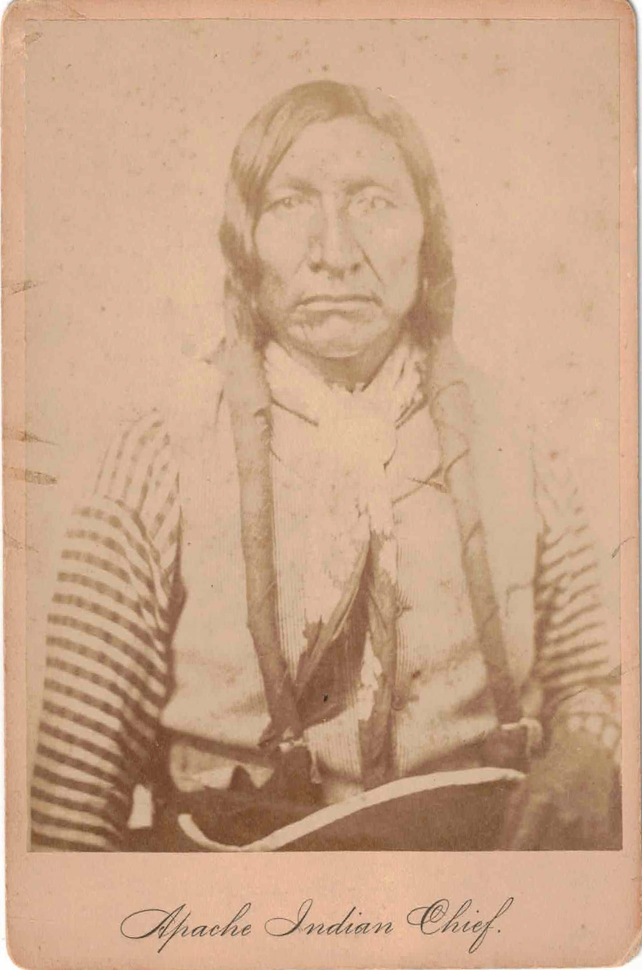 'APACHE INDIAN CHIEF' PHOTOGRAPHIC PORTRAIT: Cabinet card photographic portrait of an unidentified 'Apache Indian Chief', 4.25 x 6.5 in., the sitter and studio unidentified. This photo was almost certainly taken by WILLIAM S. SOULE (1836-1908),