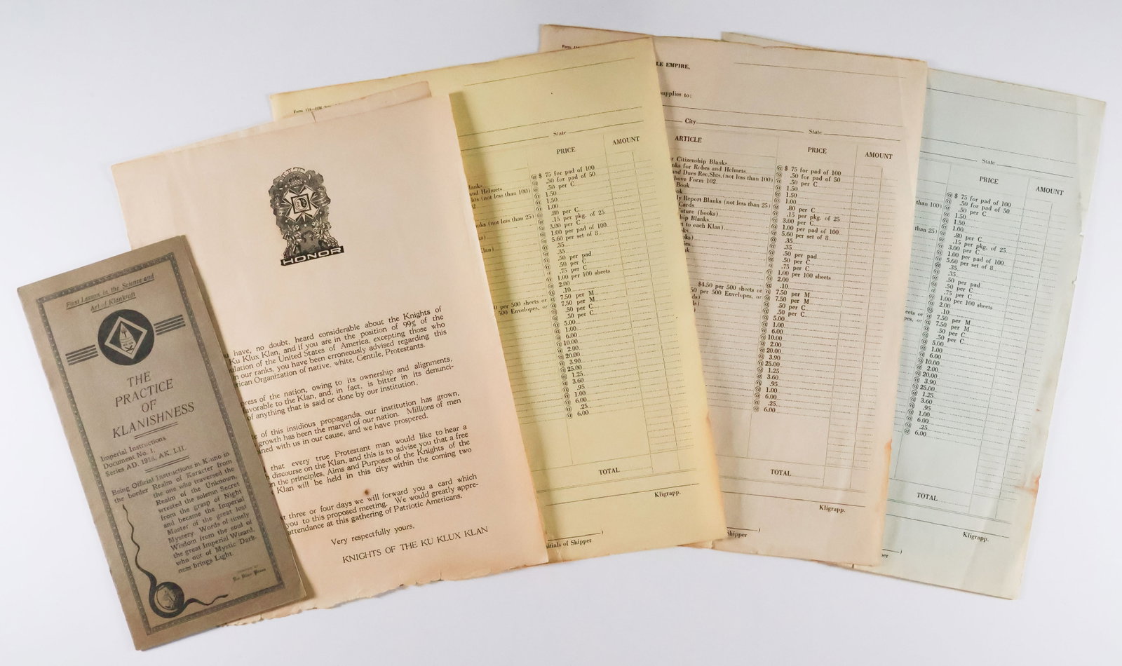 KU KLUX KLAN MANUAL AND FORMS: Lot of four pieces of ca. 1920s Klan paperwork, includes: a 12pp. booklet 'The Practice of Klanishness', or the proper mentality to be maintained by Klansmen; a handout given to prospective members