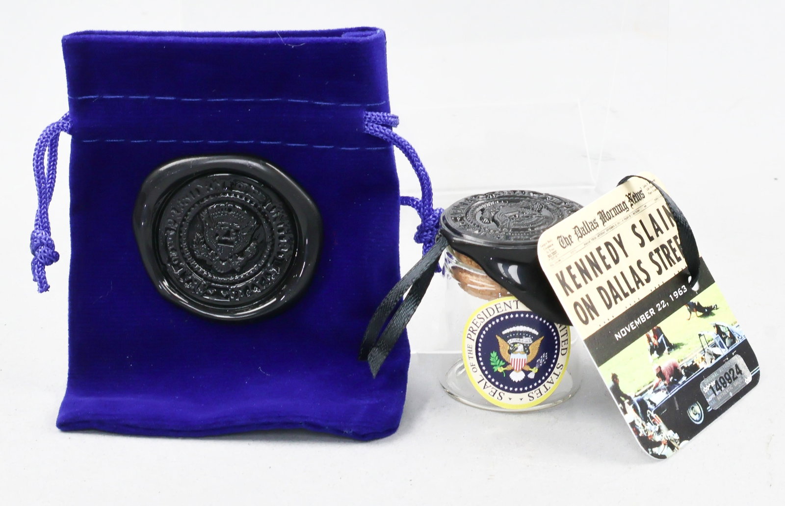 JOHN F. KENNEDY ASSASSINATION RELIC: An evocative relic Kennedy’s assassination, a circular piece of leather, 3/8 in. in diameter, housed within a small jar with ‘wax’ Presidential seal securing the corked stopper. A