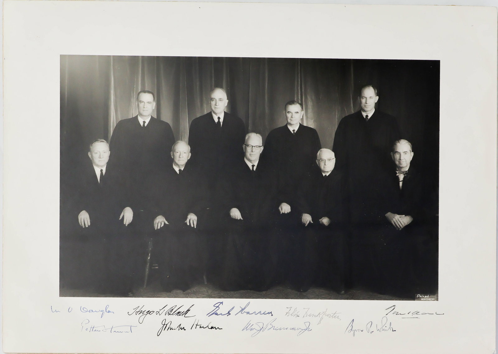 1962 EARL WARREN U.S. SUPREME COURT: Very desirable signed formal photograph of the entire Earl Warren U.S. Supreme Court, ca. 1962, one of the most influential court in the country's history whose Brown vs. Topeka Board of Education