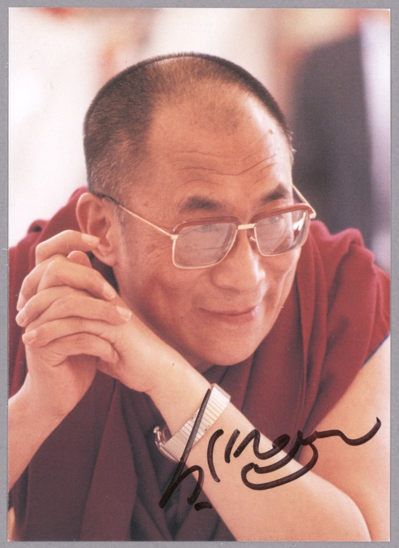 DALAI LAMA: (b. 1935) The highest Tibetan Buddhist leader, now exiled in India. S.P. 3.5 x 5 in. color, boldly signed at bottom and in fine condition.