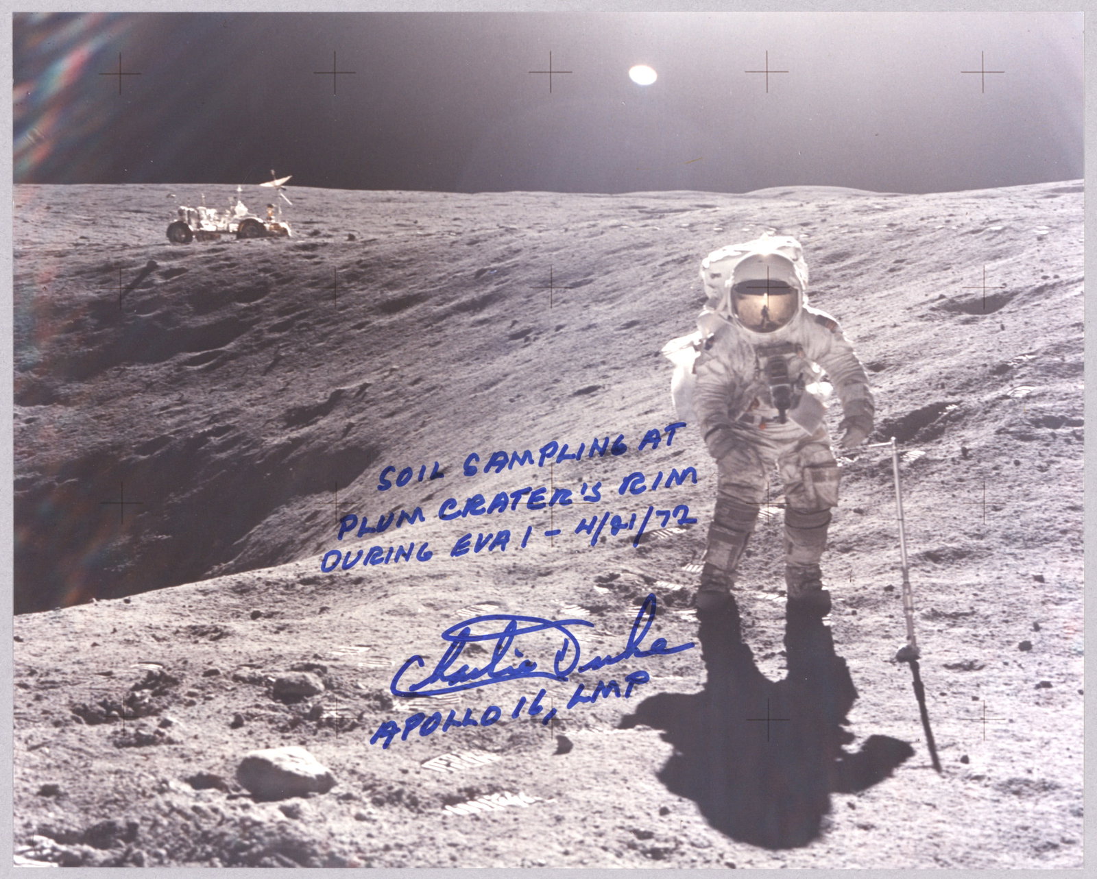 CHARLES M. DUKE: (b. 1935) American astronaut who flew on the Apollo 16 mission, one of only twelve to walk on the moon. Great S.P., 10 x 8 in. color on Kodak paper, shows Duke taking soil samples with the Lunar