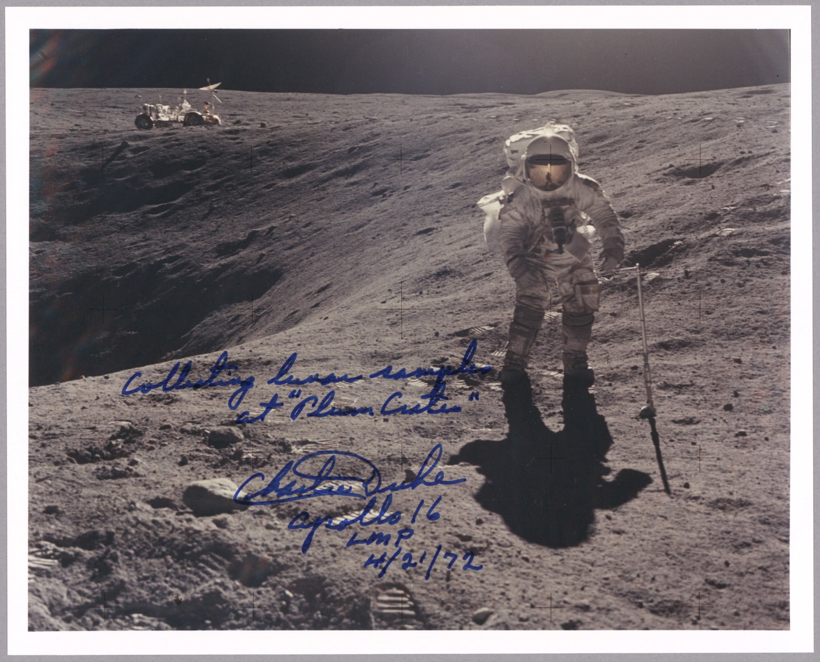 CHARLES M. DUKE: (b. 1935) American astronaut who flew on the Apollo 16 mission, one of only twelve to walk on the moon. Great S.P., 10 x 8 in. color on Kodak paper, shows Duke taking soil samples with the Lunar