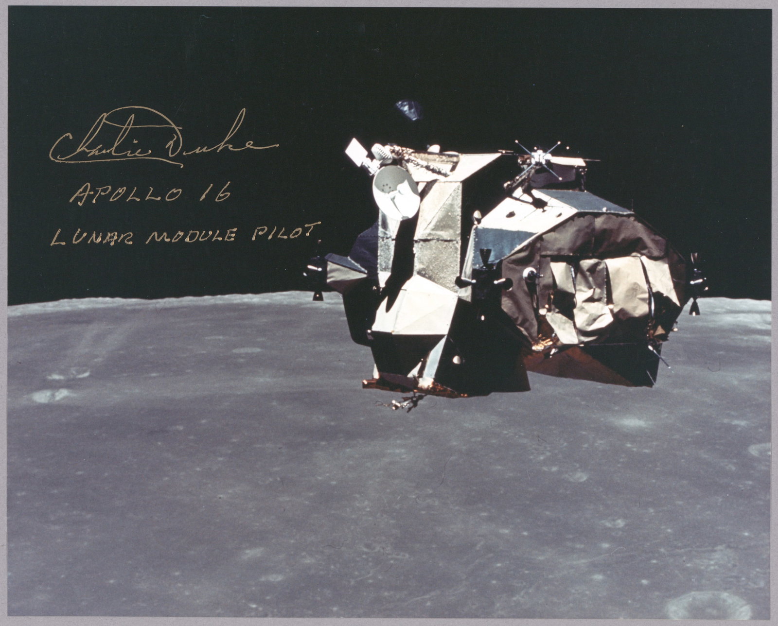 CHARLES M. DUKE: (b. 1935) American astronaut who flew on the Apollo 16 mission, one of only twelve to walk on the moon. S.P., 10 x 8 in. color, a photo of the Apollo 16 Lunar Excursion Module after separation from