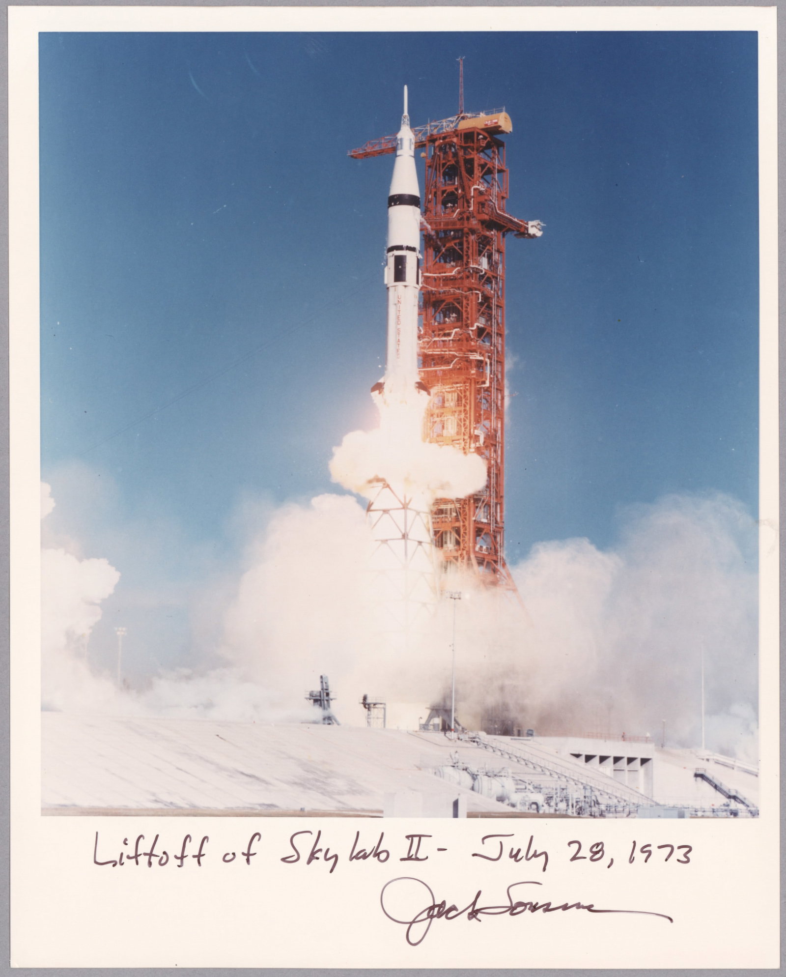 JACK LOUSMA: (b. 1936) American astronaut who flew on the Gemini 7 and Apollo 8 missions. S.P., 8 x 10 in. color on Kodak paper, shows the lift off of Skylab II, inscribed and signed: 'Lift off of Skylab II -