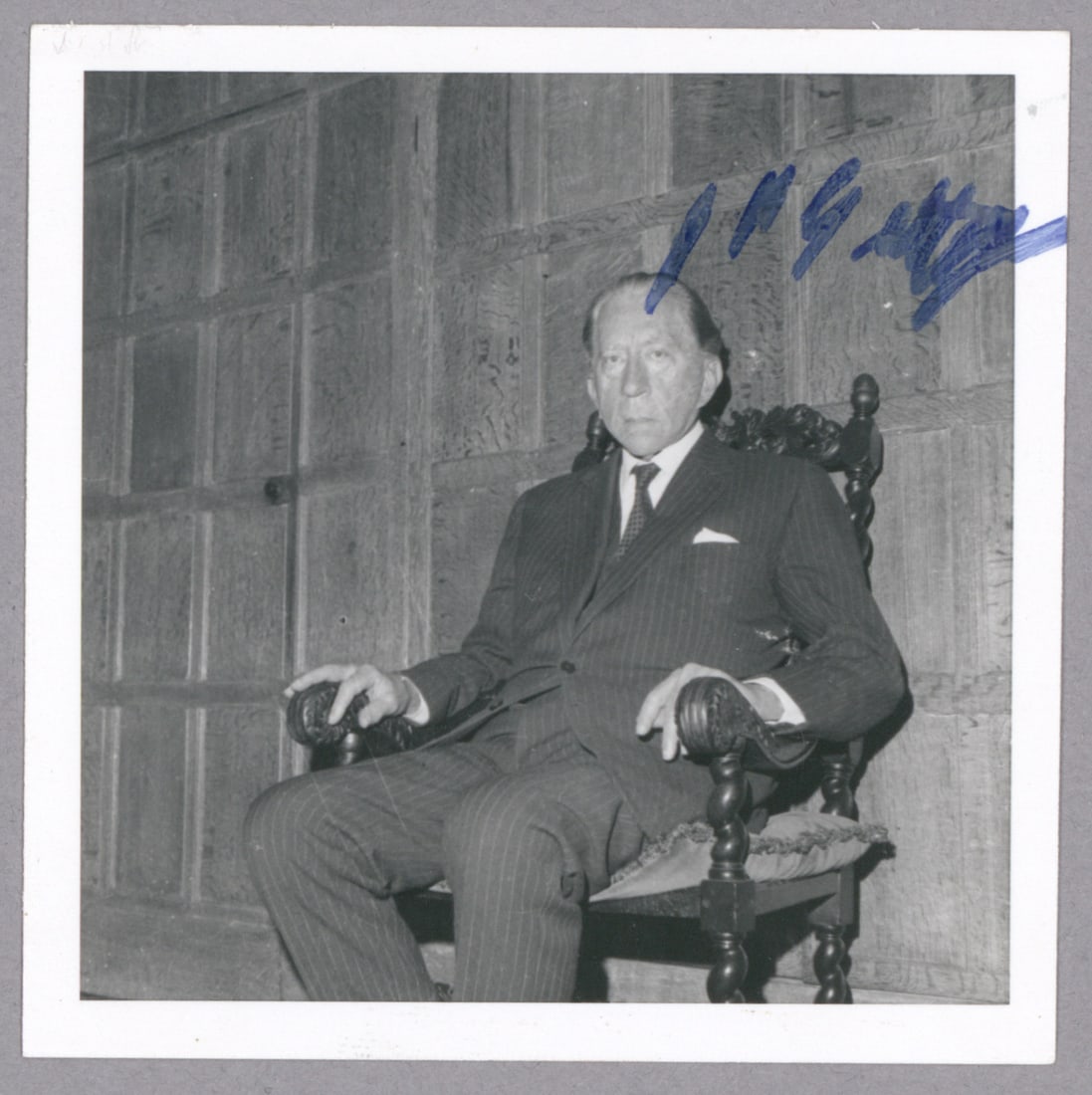 JEAN PAUL GETTY: (1892 - 1976) American businessman who accumulated over a billion dollars in profit from his oil investments. S.P. 3.5 x 3.5 in. b/w, a seated pose in an ornate armchair, boldly signed in blue