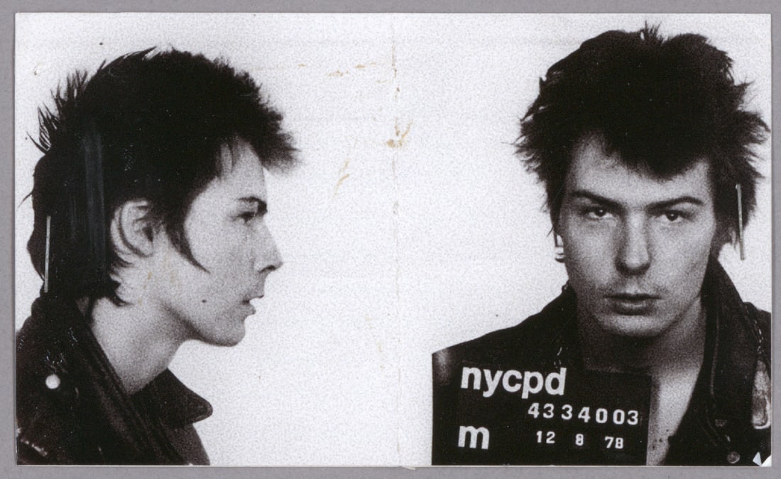 SID VICIOUS' MUG SHOT: SID VICIOUS (1957-1979) born Simon Richie, was the bassist of the seminal punk band The Sex Pistols. A very rare relic, Vicious’ mug shot, 5 in. x 8 in. b/w, for his arrest on the violation of
