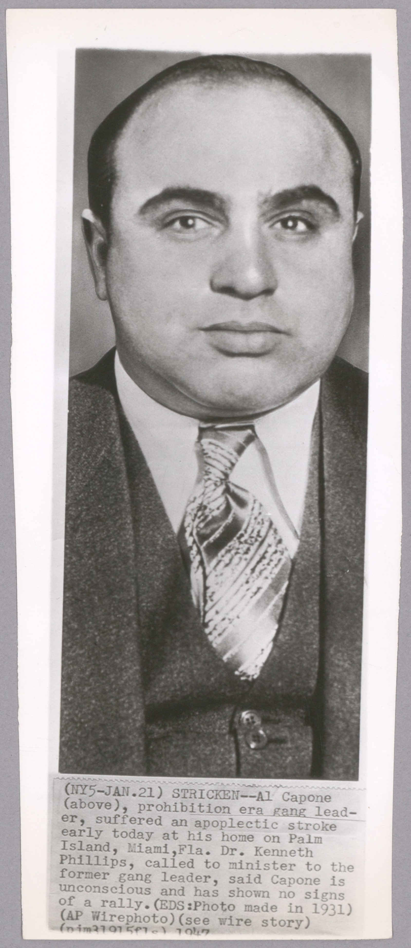 (ALPHONSE CAPONE): An original press photo, measures 4.5 X 10.5 in. b/w, a Jan. 23, 1947 Associated Press portrait photograph of Capone, trimmed slightly at right. Fine. Capone was on his deathbed following a stroke