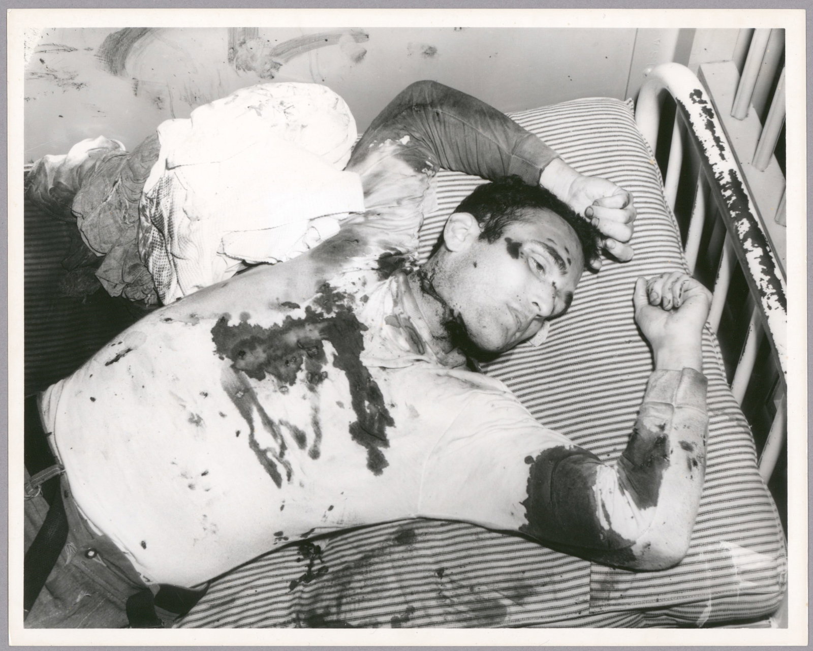(ATTICA PRISON RIOTS): Two graphic original photographs showing inmates slain during the notorious Attica riots of 1971. The first, 10 in. x 8 in. b/w, shows an inmate killed on his cot, while the second, 6 in. x 6 in.