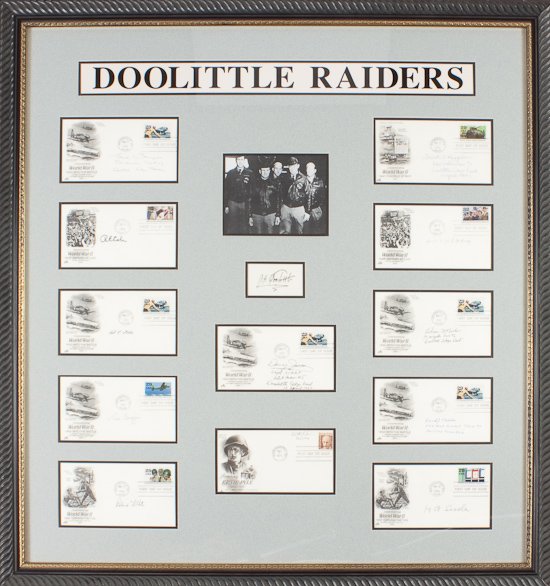 DOOLITTLE RAIDERS: DOOLITTLE RAIDERS A fine framed presentation piece assembling items signed by Gen. JAMES H. DOOLITTLE and twelve airmen who flew with him on their historic air raid on Tokyo on Apr. 18, 1942. At cente