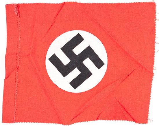 CAPTURED NSDAP FLAG: CAPTURED NSDAP FLAG Small NSDAP flag, 9 1/2" x 7 1/2", red rayon with white circular field and black mobile swastika sewn thereon, with a loop at one end to allow its hanging vertically from a dowel. 