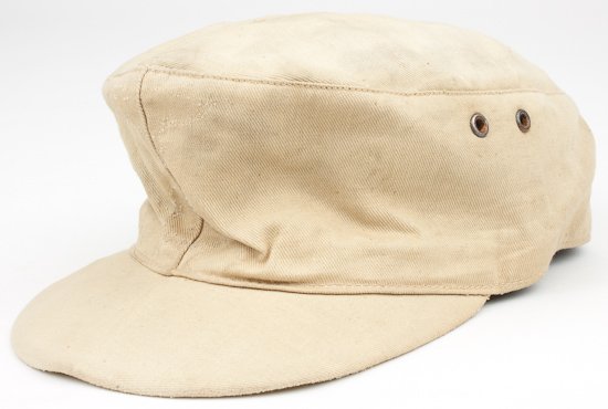 WAFFEN-SS TROPICAL M43 CAP: WAFFEN-SS TROPICAL M43 CAP Scarce Waffen-SS M43 tropical cap, tan cotton twill fabric, two-piece top construction, with two ventilation holes on each side panel. Insignia at front were removed but cle