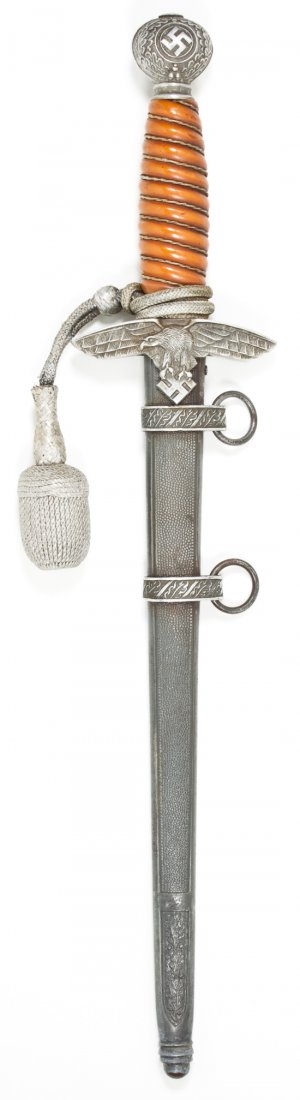 2ND MODEL LUFTWAFFE DAGGER: 2ND MODEL LUFTWAFFE DAGGER Nice example of a 2nd Model Luftwaffe dagger and scabbard. The pommel bears good detail with oak leaves and swastika still very sharp and distinct. The feathers on the wings