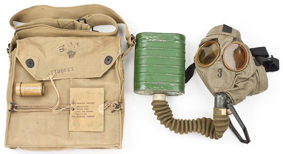 AMERICAN SOLDIER'S GAS MASK: AMERICAN SOLDIER'S GAS MASK American soldier's gas mask and carrying bag, the gas mask and hose itself excellent with no tears, green canister paint chipped, in khaki carrying case with strap. Overall