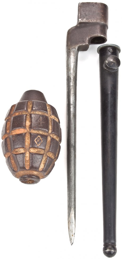 PRACTICE GRENADE WITH BAYONET: PRACTICE GRENADE WITH BAYONET World War I practice iron fragmentation grenade, a de-militarized example measuring 3 1/2" long, completely hollow. Marked with a "4" and and also with an "F" within a di