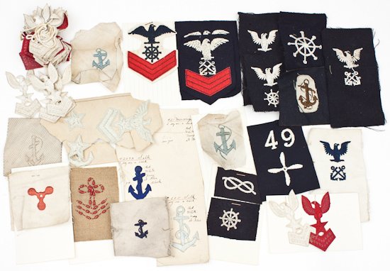 NAVY INSIGNIA: NAVY INSIGNIA Large grouping of about 40 pieces of cloth Navy insignia, various dates and for various ratings, apparently all salesmen's samples. There are some rarer items in the group, which should 