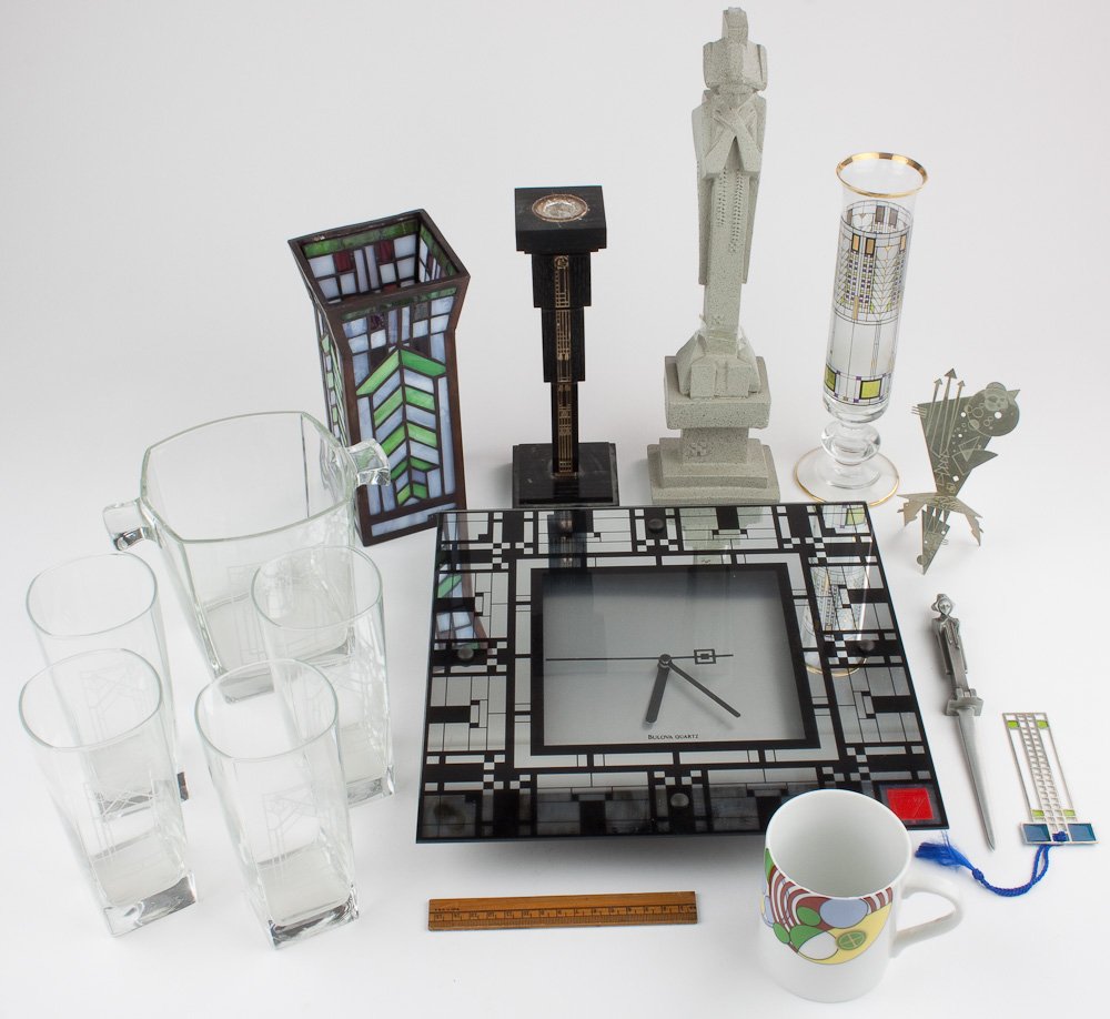 FRANK LLOYD WRIGHT COLLECTIBLES: FRANK LLOYD WRIGHT COLLECTIBLES Group of various collectibles celebrating the work of Frank Lloyd Wright, includes a Bulova wall clock, leaded stained glass vase, glass vase, glassware, letter opener,