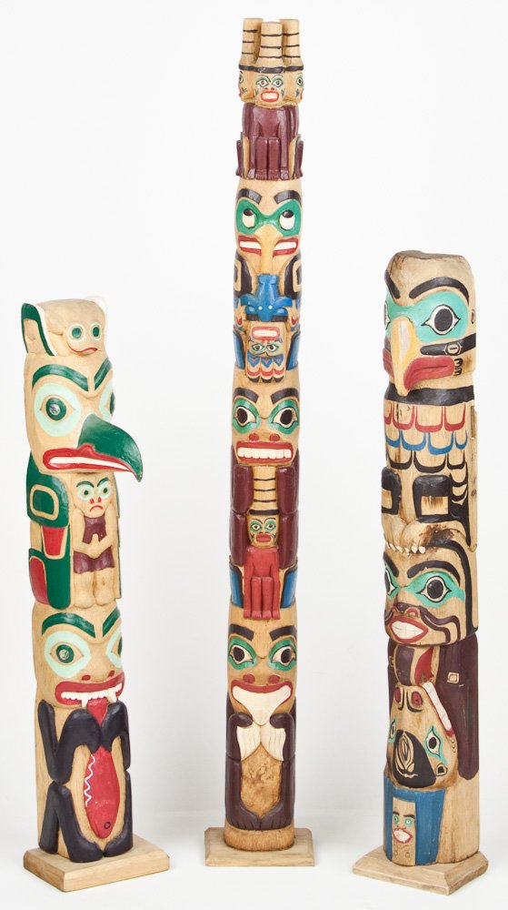 TOTEM POLES: TOTEM POLES Three American hand-carved and painted totem poles, various designs, heights 25", 26 1/2", 36".