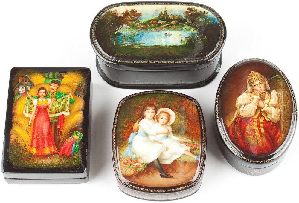 FOUR RUSSIAN HAND-PAINTED AND LACQUERED BOXES: FOUR RUSSIAN HAND-PAINTED AND LACQUERED BOXES Fine grouping of four hand-painted and lacquered Russian boxes, all from Fedoskino and signed, the river scene bearing some crazing to the lacquer. Averag