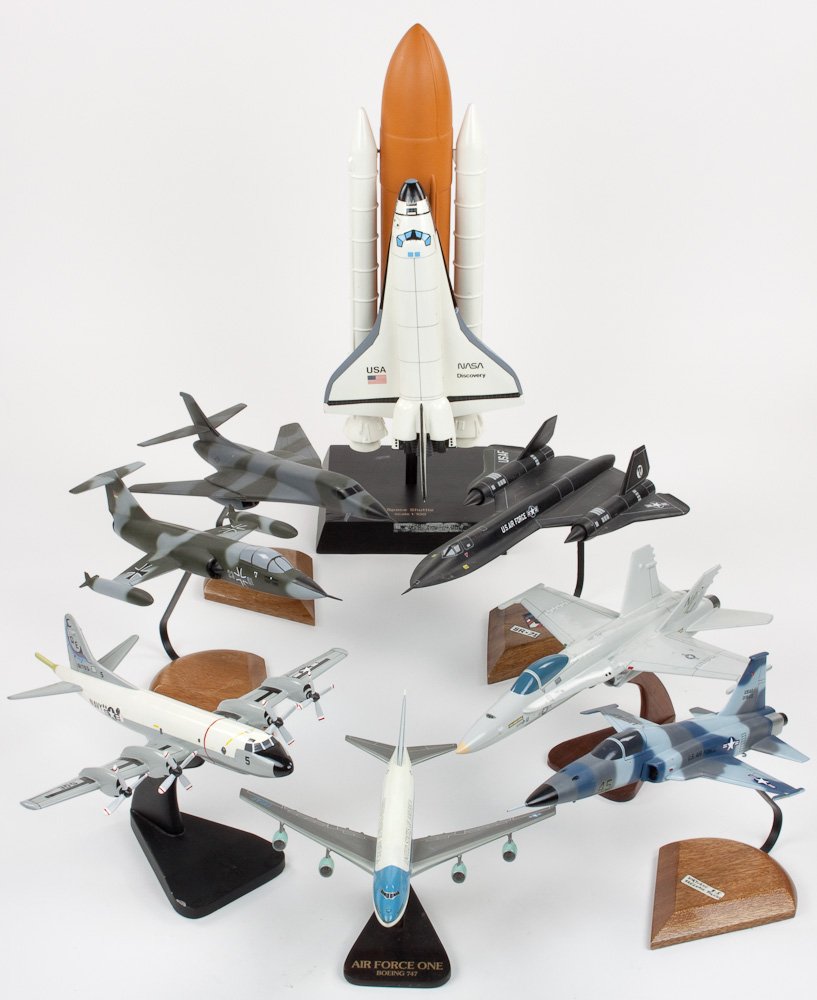 MODEL AIRCRAFTS: MODEL AIRCRAFTS Group of eight painted models of aircraft, almost all made of wood, include Air Force One, P3 Orion (one blade missing from a prop), SR 71, space shuttle, a German fighter, etc. Each a