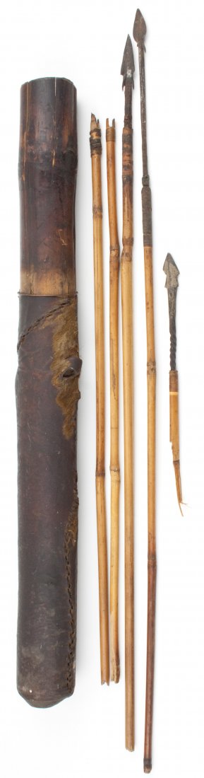 NATIVE'S QUIVER AND ARROWS: NATIVE'S QUIVER AND ARROWS Antique quiver and arrows, likely South American or Indonesian origin, ca. late 1800s. The bamboo quiver is 21" long and largely covered in a fur-bearing animal's skin stitc