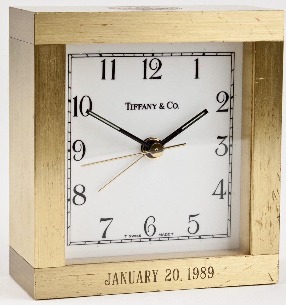 GEORGE W. BUSH INAUGURATION TIFFANY PRESENTATION CLOCK: GEORGE W. BUSH INAUGURATION TIFFANY PRESENTATION CLOCK Presentation desk clock given as a gift to commemorate the inauguration of George H. Bush a president , a Tiffany 3 1/4" x 3 1/2" x 1 1/2" heavy 