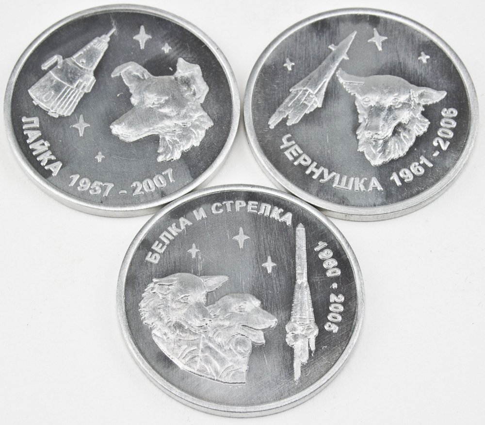 SOVIET DOGS IN SPACE MEDALS: SOVIET DOGS IN SPACE MEDALS Three Russian medallions made of space used alloy, issued 2005-07, 1 1/4" dia., individually picture Russia's first space pioneers...dogs, and images of the craft that carr