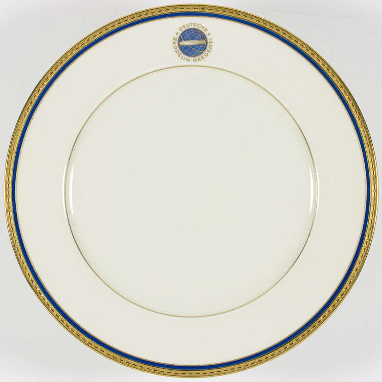 GERMAN ZEPPELIN DESSERT PLATE: GERMAN ZEPPELIN DESSERT PLATE Scarce dessert plate from the ""Deutsche Zeppelin Reederei"" the firm which owned and operated the airships Hindenburg and Graf Zeppelin and on one of which such airships