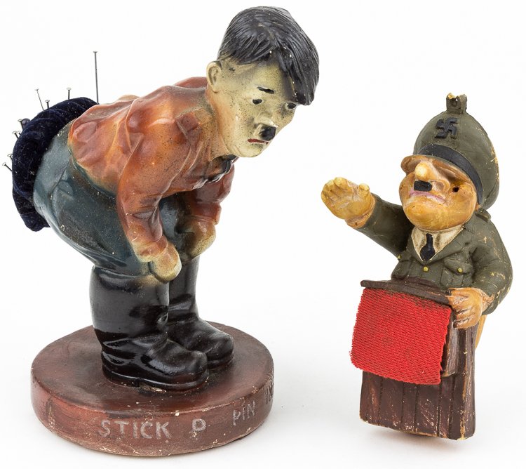 ANTI-HITLER NOVELTIES: ANTI-HITLER NOVELTIES Pair of anti-Hitler novelty items undoubtedly produced during the war, includes: ceramic Hitler figure, 6" tall, shows him bent over with his rear in use as a pin cushion, the ba