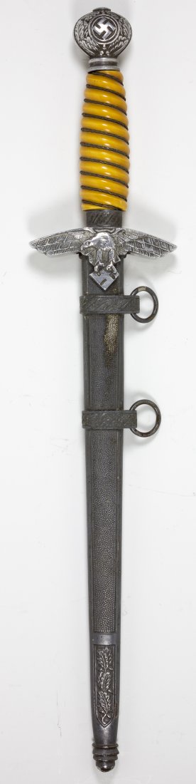 2ND MODEL LUFTWAFFE DAGGER: 2ND MODEL LUFTWAFFE DAGGER Good example of a 2nd Model Luftwaffe dagger and scabbard. The pommel bears fair detail with oak leaves and swastika still distinct. The feathers on the wings and breast of
