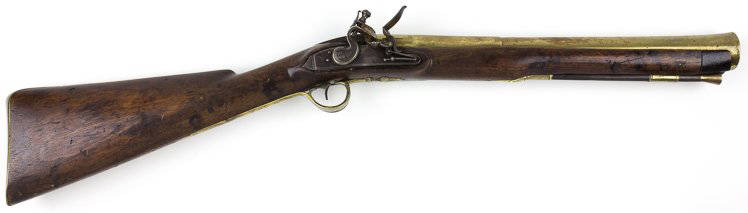 CIRCA 1790 BRITISH BRASS BLUNDERBUSS: CIRCA 1790 BRITISH BRASS BLUNDERBUSS A 31 1/2" long British "blunderbuss" with a heavy 16 3/8" brass barrel having a 1 1/4" bore at the flared muzzle. The barrel is round with step downs at the breech