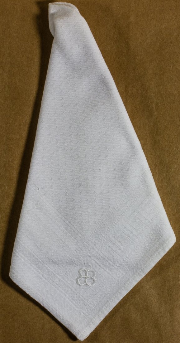 EVA BRAUN LINEN NAPKIN: EVA BRAUN LINEN NAPKIN Informal white linen napkin from a set once owned by Eva Braun, 16 1/2" x 16" an embroidered in one corner with the "EB" "butterfly" monogram designed for her by Albert Speer. T