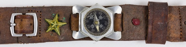 JAPANESE SOLDIER'S WRIST COMPASS: JAPANESE SOLDIER'S WRIST COMPASS Japanese soldier's leather wrist compass, 8 1/2" long overall, bears a rather primitive compass with a small strap with which a watch may be attached. Sold with the or