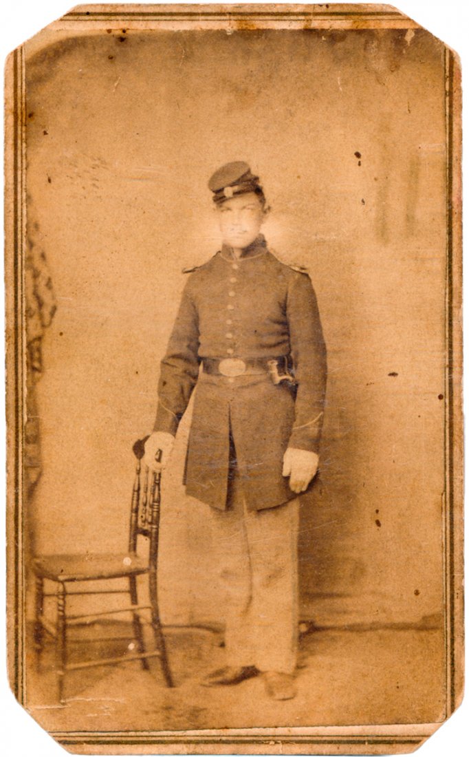FORT SANDERS INDIAN FIGHTER: FORT SANDERS INDIAN FIGHTER A good ca. 1866 Indian War CDV showing Private Samuel Moon, Co. D, 36th U.S. Infantry as he appeared at Fort Sanders, Dakota Territory in his Civil War style dress uniform.