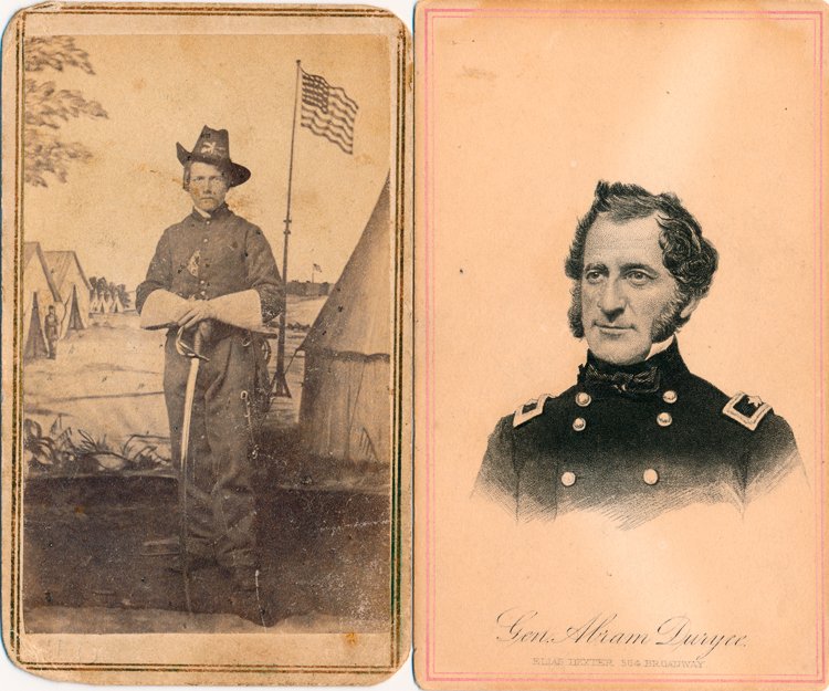IDENTIFIED "EMPIRE LIGHT" CAVALRYMAN: IDENTIFIED "EMPIRE LIGHT" CAVALRYMAN Carte de visite photograph of Pvt. George E. Duel of the 2nd Veteran N.Y. "Empire Light" Cavalry, showing him standing in cavalry outfit with sword before a painte