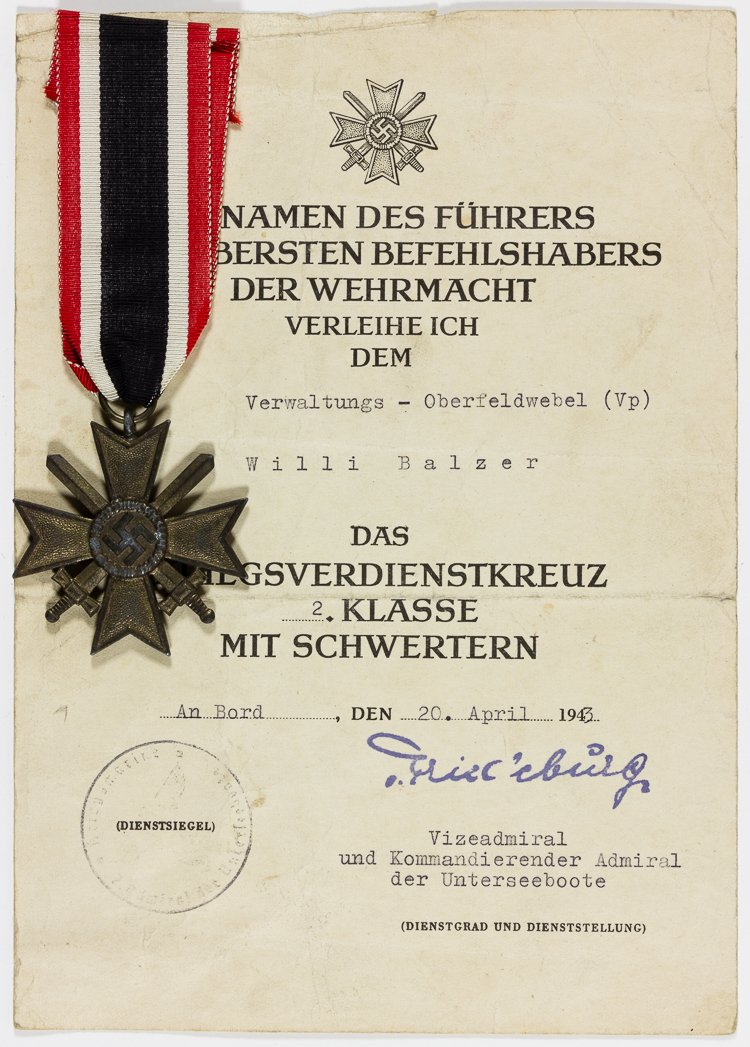 U-BOAT OFFICER IS AWARDED WAR MERIT CROSS WITH SWORDS: U-BOAT OFFICER IS AWARDED WAR MERIT CROSS WITH SWORDS Rare award given to a U-boat officer, a War Merit Cross, 2nd Class with Swords awarded unto Oberfeldwebel Will Balzer "On Board", Apr. 20, 1943, s