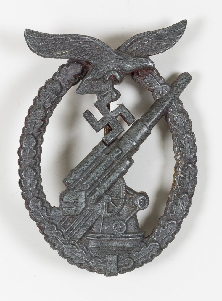 FLAK GUNNER BADGE: FLAK GUNNER BADGE Flak Gunner Badge in zinc alloy marked on reverse "G.B." by maker Gustav Brehmer Markneukirchen. Very good.