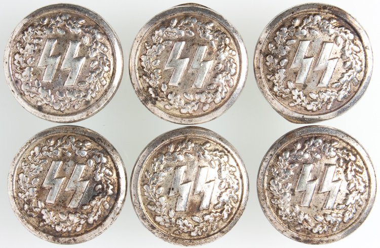 SS BUTTONS FROM A SMOKING JACKET: SS BUTTONS FROM A SMOKING JACKET Six buttons 0.71" (18 mm) in diameter, with the SS insignia surrounded by oak leaves, shiny silver finish, probably nickel, for an evening dress uniform or vest. Manuf