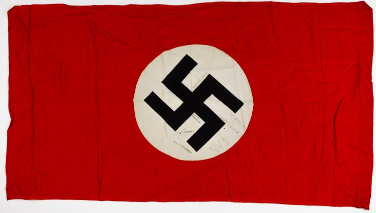 CAPTURED AND SIGNED REICHSKRIEGSFLAGGE: CAPTURED AND SIGNED REICHSKRIEGSFLAGGE N.S.D.A.P. flag, 42" x 30" two-piece construction, signed on the white field by eleven American soldiers, possibly those who took this flag as a prize. Fine cond