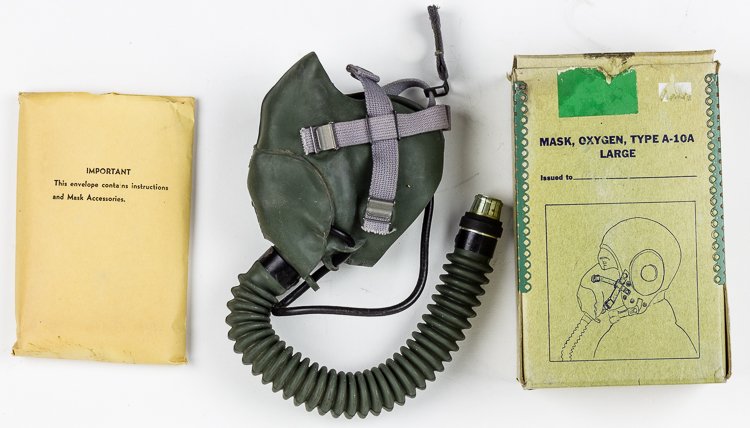 (ZEMKE'S WOLF PACK) A-10 MASK AND MIC, BOXED: (ZEMKE'S WOLF PACK) A-10 MASK AND MIC, BOXED American aviator's oxygen mask with built-in microphone, issued to a member of "Zemke's Wolf Pack", the 56th Fighter Group. Packaged in its original box. S