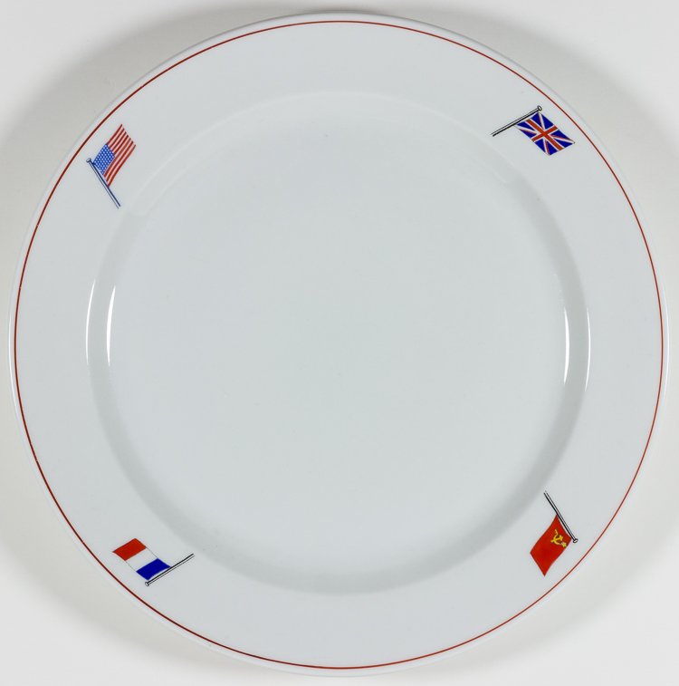 "BIG FOUR" DINNER PLATE: "BIG FOUR" DINNER PLATE Fine china dinner plate, 9 1/2" in diameter, decorated around the rim with the flags of Britain, France, the United States, and the Soviet Union. The base is marked with the nu