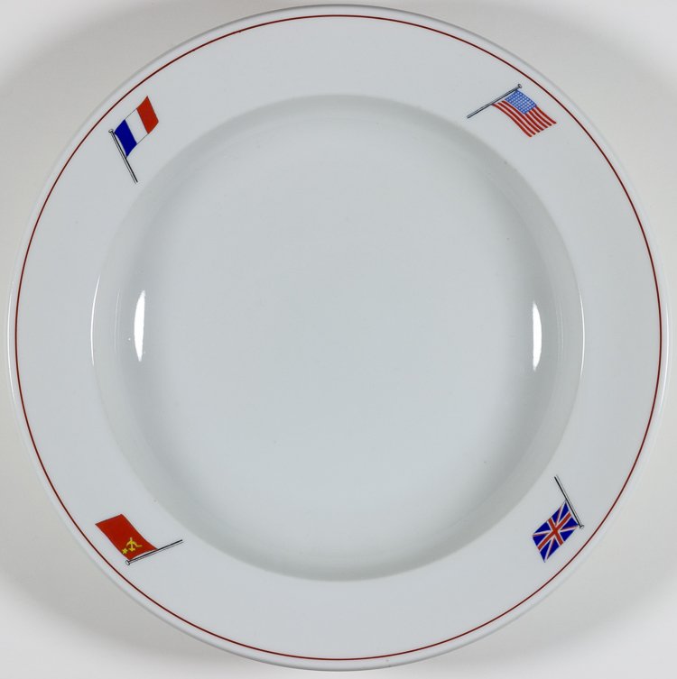 'BIG FOUR" SOUP PLATE: 'BIG FOUR" SOUP PLATE Fine china soup plate, 9" in diameter, decorated around the rim with the flags of Britain, France, the United States, and the Soviet Union. The base is marked with the number "53